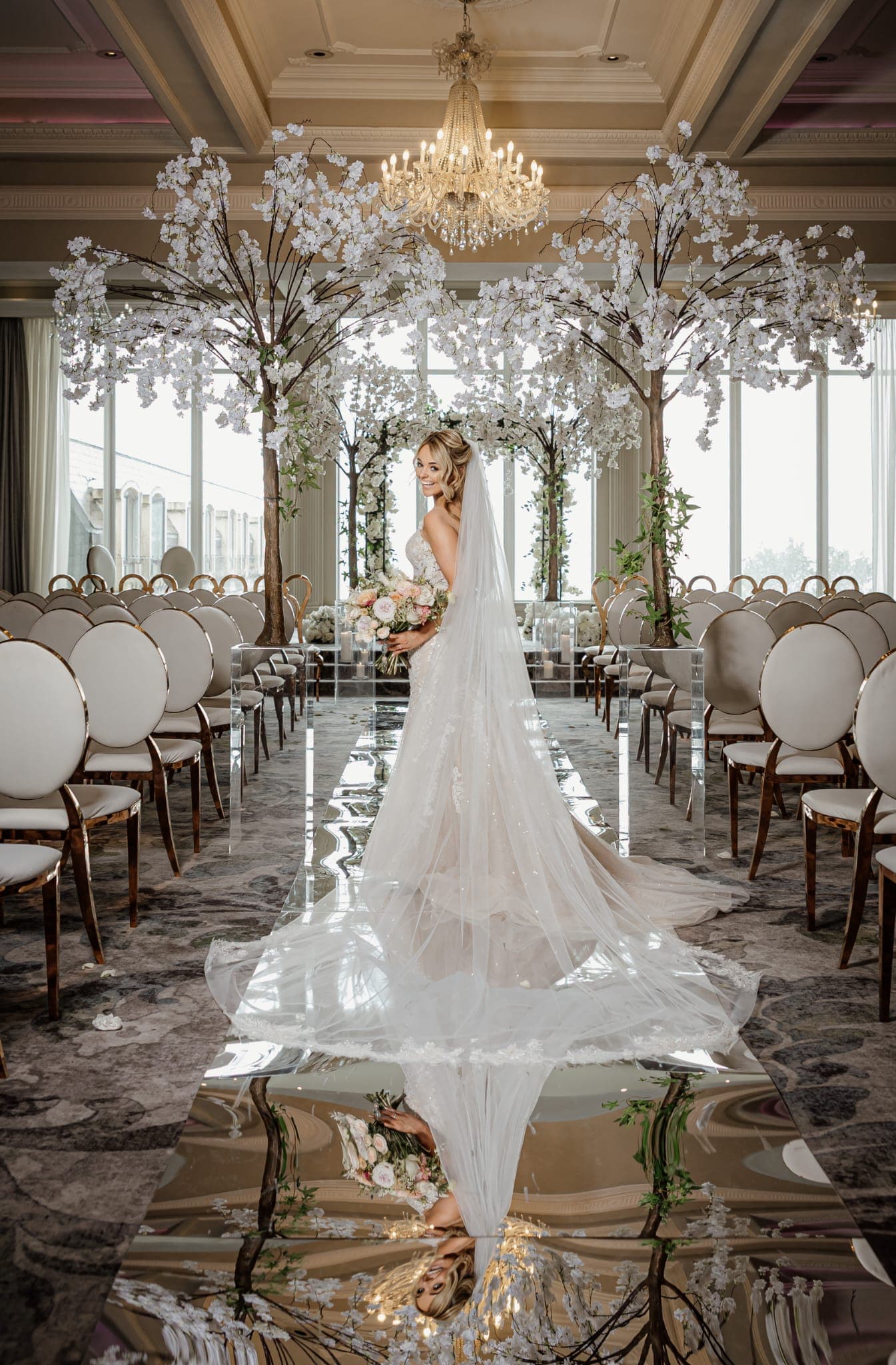 Elegant wedding setup with beautiful chairs and champagne decor